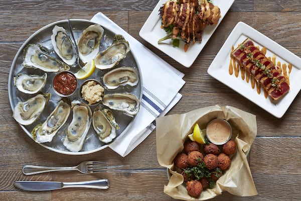 Left: Oysters on the Half Shell, Top: Beach Balls - surf and turf fritters with bacon, shrimp and green onions, served with key lime mango sauce, Right: Seared Tuna - sushi grade ahi tuna, house-made spice rub, served with cucumber salsa and creamy soy, Bottom: Hushpuppies served with remoulade (Lauren Rubinstein).