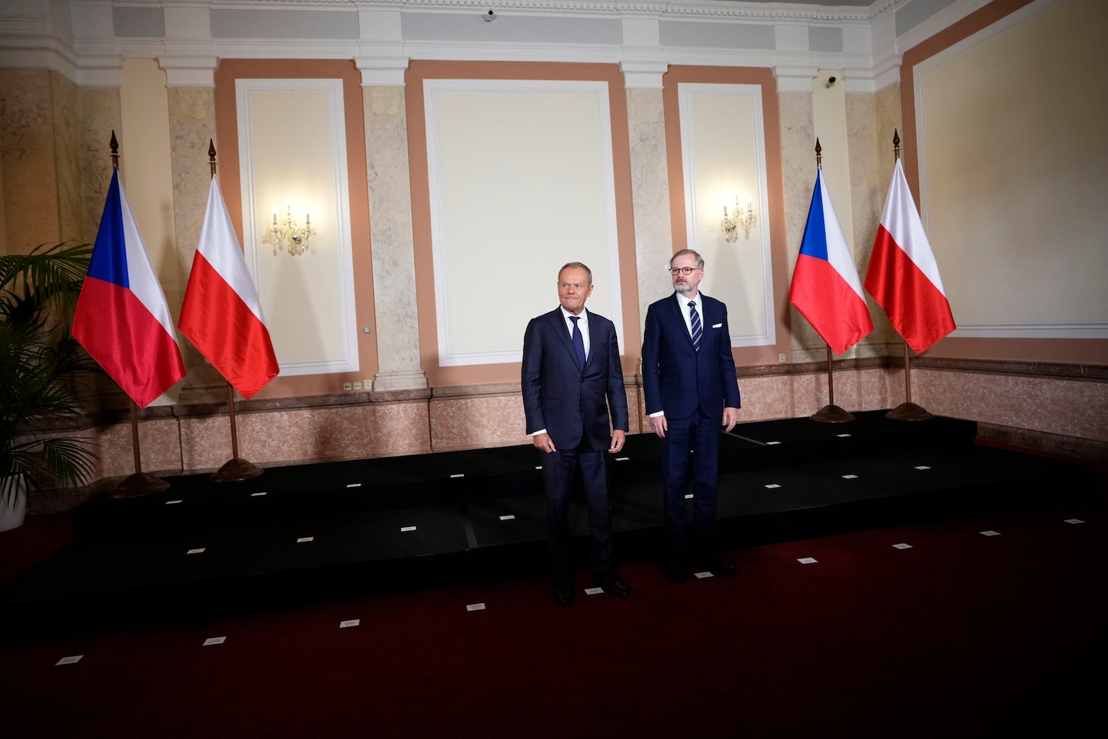 Czech Republic's Prime Minister Petr Fiala, right, welcomes his Poland's counterpart Donald Tusk as they meet in Prague, Czech Republic, Wednesday, Oct. 9, 2024. (AP Photo/Petr David Josek)