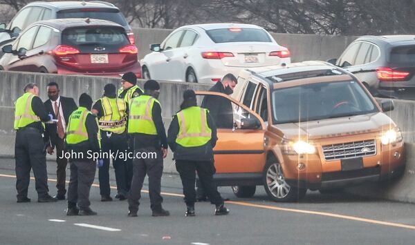 Police are focusing their investigation on an orange Land Rover SUV that crashed into a wall.