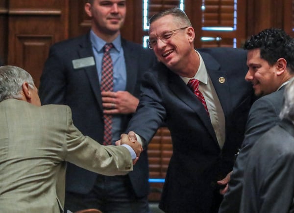 January 28, 2020 Atlanta: U.S. Rep. Doug Collins (center) shakes hands with members of the House before he addressed the Georgia House on Tuesday, Jan. 28, 2020 as its Chaplin of the day. This coming just hours after news broke that Collins is preparing to challenge U.S. Sen. Kelly Loeffler, and avoided any mention of seeking a higher office. In his sermon and closing prayer, Collins honored Rep. Jay Powell, the House Rules Committee chairman who died in November and who Collins described as a mentor. Speaker David Ralston signaled his support of the soon-to-be senate candidate, stopping short of an explicit endorsement. Collins and Ralston have a strong relationship dating back to their time as state house colleagues; Collins voted for Ralstonâ€™s speakership while deployed in Iraq. â€œHe is my friend. He has stood by me when few would,â€ Ralston said.â€And I donâ€™t forget things like that.â€ JOHN SPINK/JSPINK@AJC.COM