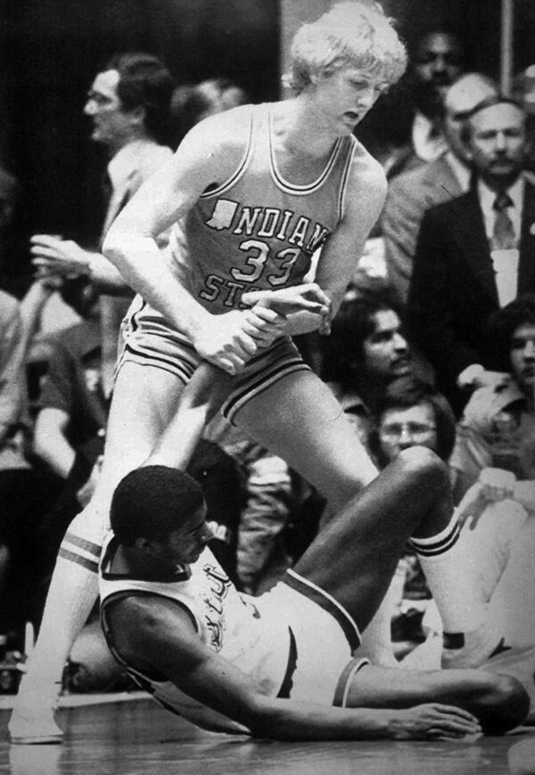 Indiana State's Larry Bird (33) gives a helping hand to a fallen Magic Johnson, of Michigan State, during the final game of the NCAA men's basketball championship in Salt Lake City, in this March 26, 1979 photo. (AP Photo/File)