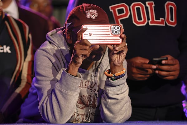 Filmmaker Spike Lee takes a photo of Sen. Raphael Warnock while he makes his victory speech at Atlanta Marriott Marquis on Tuesday, December 6, 2022. (Natrice Miller/natrice.miller@ajc.com)  