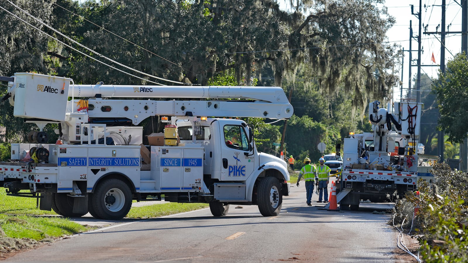 Pike Corporation linemen, of North Carolina, work to repair power lines damaged by Hurricane Milton Sunday, Oct. 13, 2024, in Valrico, Fla. (AP Photo/Chris O'Meara)