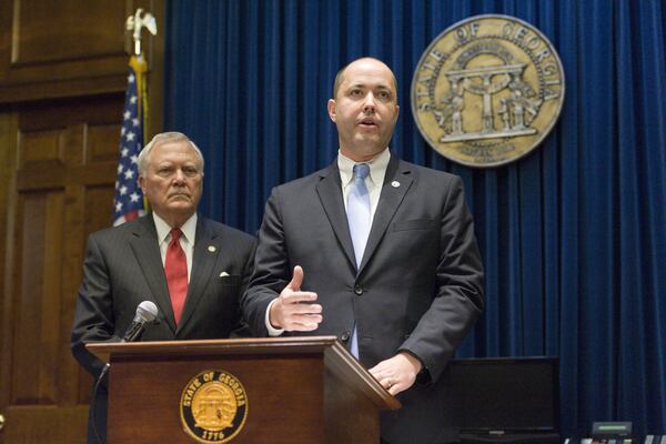 Chris Carr (right) answers questions as Gov. Nathan Deal listens during a press conference in October 2016 in Atlanta regarding Carr’s appointment as Georgia’s next attorney general. 