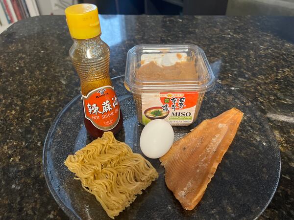 Hot sesame oil, miso paste, ramen noodles, smoked trout and egg are the ingredients for a simple spicy sesame miso ramen. Kelly Yamanouchi/kelly.yamanouchi@ajc.com