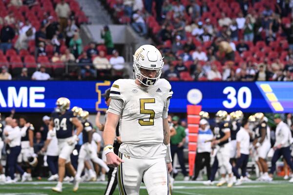 Georgia Tech quarterback Zach Pyron (5) reacts after his pass was intercepted and scored by Notre Dame safety Adon Shuler (8) during the second half in an NCAA football game at Mercedes-Benz Stadium, Saturday, October 19, 2024, in Atlanta. Notre Dame won 31-13 over Georgia Tech. (Hyosub Shin / AJC)