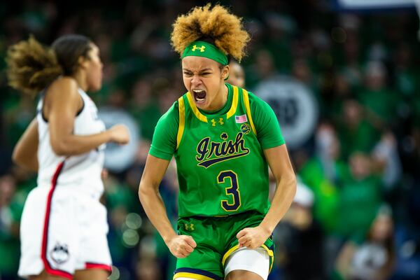 Notre Dame guard Hannah Hidalgo (3) celebrates during the first half of an NCAA college basketball game Thursday, Dec. 12, 2024, in South Bend, Ind. (AP Photo/Michael Caterina)