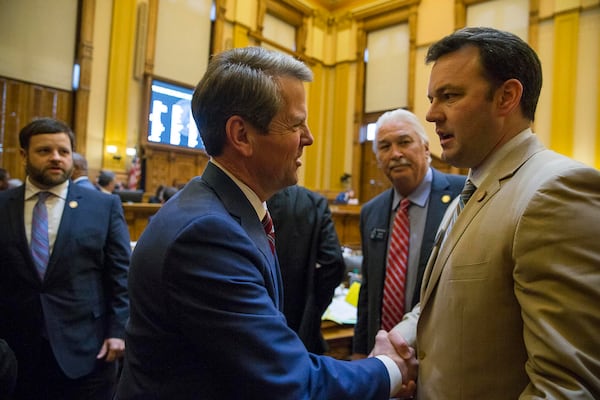 Gov. Brian Kemp, left, shakes hands with state Sen. Burt Jones, who was part of a group of state lawmakers who wrote a letter to Vice President Mike Pence urging him to delay the certification of the Electoral College vote. Jones and the others never sent the letter, he said, because they “saw the writing on the wall.” But Jones is still trying to appeal to President Donald Trump's base of supporters in Georgia, calling for changes in the state's election laws. “There was an element of voters out there who felt disenfranchised by the November results, and they’re still upset,” Jones said. “If you don’t address some sort of election changes this session, the base is going to be furious.” ALYSSA POINTER/ALYSSA.POINTER@AJC.COM