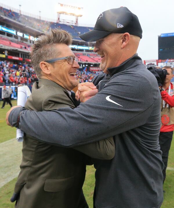 102515 NASHVILLE: -- Falcons general manager Thomas Dimitroff (left) and head coach Dan Quinn celebrate surviving the Titans for a 10-7 victory in a football game on Sunday, Oct. 25, 2015, in Nashville. Curtis Compton / ccompton@ajc.com