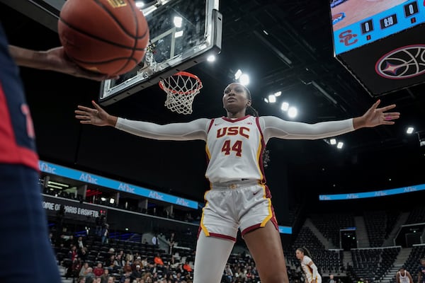 USC Trojans's forward Kiki Iriafen challenges during the basketball match between the University of Southern California (USC) and Ole Miss, Monday, Nov. 4, 2024 in Paris, France. (AP Photo/Aurelien Morissard)