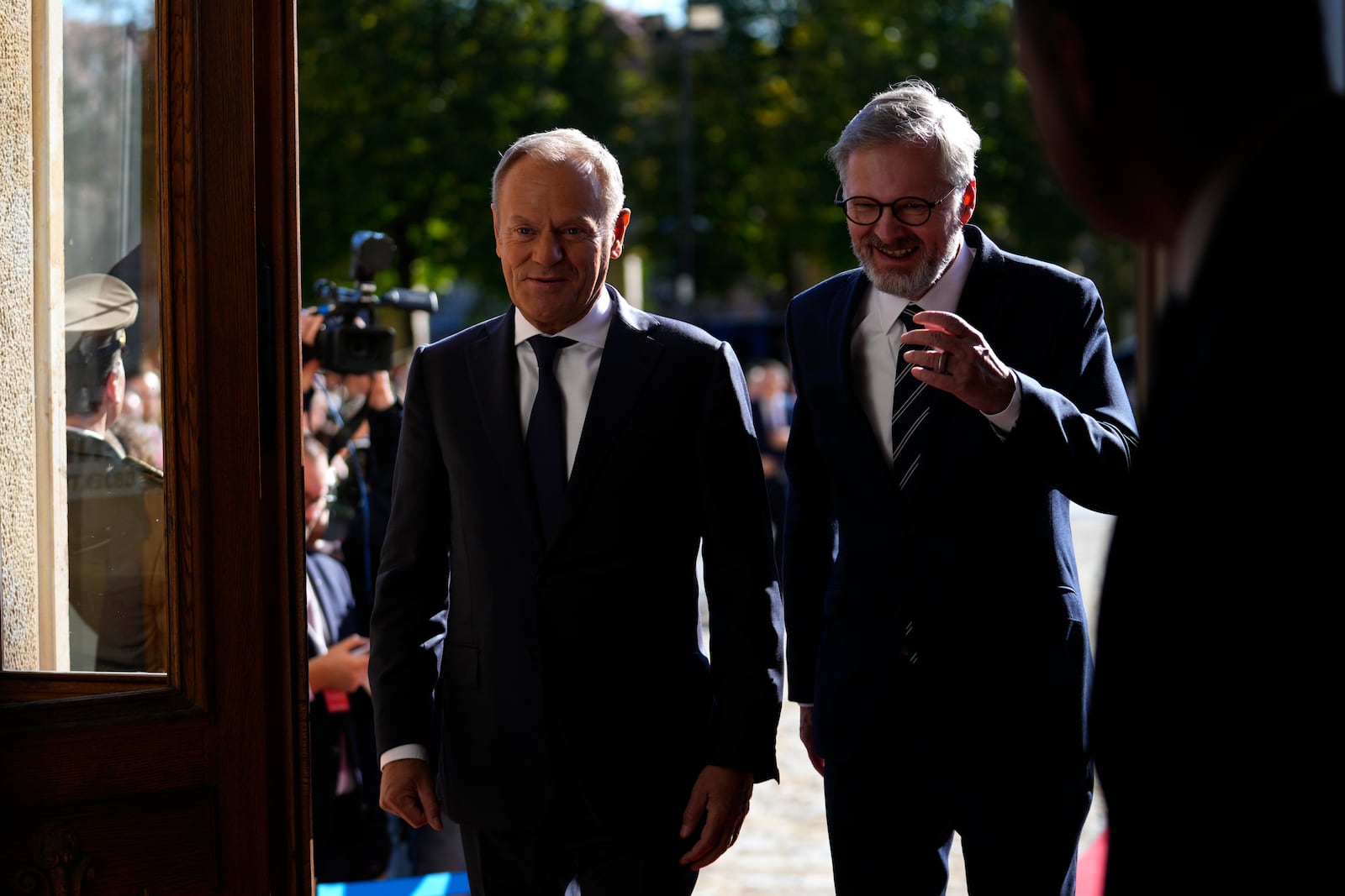 Czech Republic's Prime Minister Petr Fiala, right, welcomes his Poland's counterpart Donald Tusk as they meet in Prague, Czech Republic, Wednesday, Oct. 9, 2024. (AP Photo/Petr David Josek)