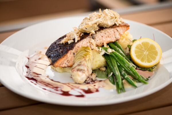  Sage Woodfire Tavern Salmon with jumbo lump blue crab, artichoke hearts, wild rice, haricot vert, and chardonnay caper beurre blanc. Photo credit- Mia Yakel.