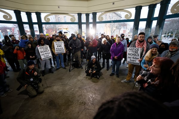 Activists and community members listen to a speaker at Decatur Square during a vigil on Sunday, January 28, 2023, in response to the killing of Tyre Nichols by Memphis police. Th Beacon Hill Black Alliance for Human Rights organized the event. (Photo: Miguel Martinez / miguel.martinezjimenez@ajc.com)