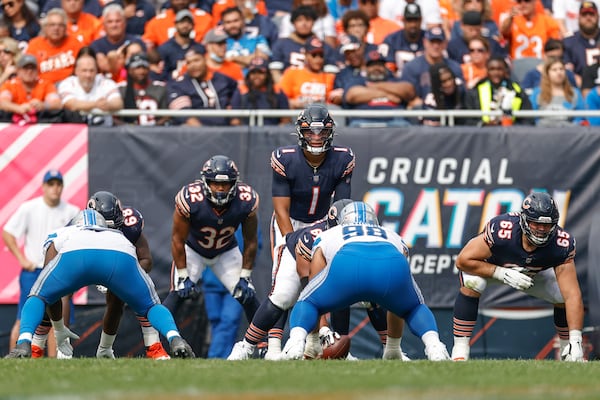 Chicago Bears quarterback Justin Fields (1) waits for the ball during the second half of an NFL football game against the Detroit Lions, Sunday, Oct. 3, 2021, in Chicago. (AP Photo/Kamil Krzaczynski)