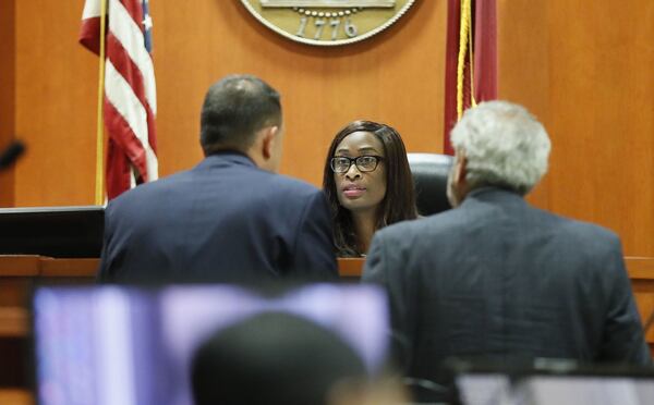 October 2, 2019 - Decatur - Prosecutor Pete Johnson (left) and defense attorney Don Samuel during a bench conference with Judge LaTisha Dear Jackson. The murder trial of former DeKalb County Police Officer Robert “Chip” Olsen continued today. Olsen is charged with murdering war veteran Anthony Hill. Bob Andres / robert.andres@ajc.com