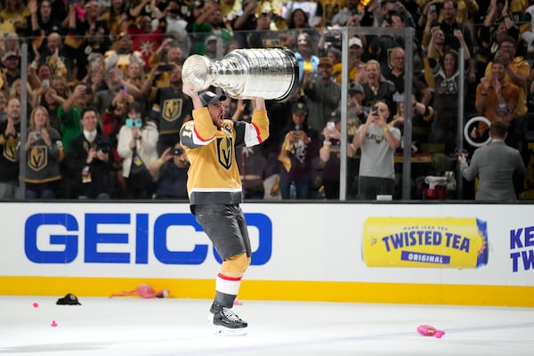 FILE - Vegas Golden Knights right wing Reilly Smith skates with the Stanley Cup after the Knights defeated the Florida Panthers in Game 5 of the NHL hockey Stanley Cup Finals, June 13, 2023, in Las Vegas. (AP Photo/John Locher, file)