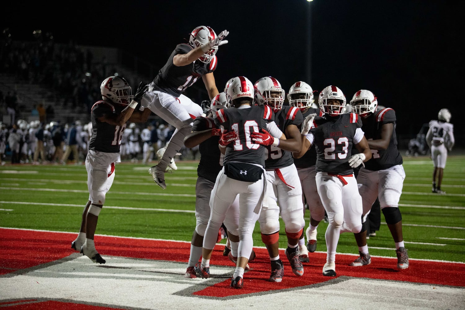 Archer players celebrate at a GHSA high school football game between Archer High School and Norcross High School in Lawrenceville, GA., on Friday, November 5, 2021. Archer won 9-0. (Photo/Jenn Finch)