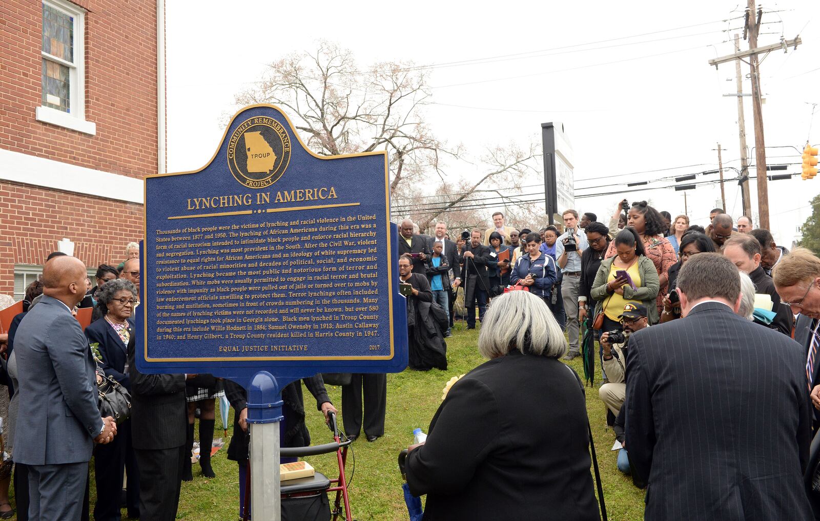 A marker to lynchings is unveiled outside the Warren Temple United Methodist Church following a “Call to Remembrance service in memory of lynching victims in Troup County,” in LaGrange, Saturday, March 18, 2017. KENT D. JOHNSON / AJC