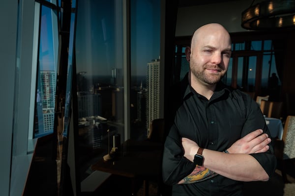 Afghanistan veteran Zack Knight poses for a portrait at the Buckhead Club in Atlanta on Friday, November 4, 2022.  Knight was a police officer in Smyrna before joining the Army. (Arvin Temkar / arvin.temkar@ajc.com)