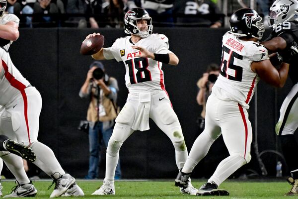 Atlanta Falcons quarterback Kirk Cousins (18) throws against the Las Vegas Raiders during the second half of an NFL football game, Monday, Dec. 16, 2024, in Las Vegas. (AP Photo/David Becker)