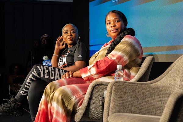 Pinky Cole (left), founder of Slutty Vegan, and Jasmine Crowe-Houston (center, CEO and Founder of Goodr) prepare to speak on a panel of Black business owners at The Gathering Spot in Atlanta on Tuesday, Aug. 27, 2024. (Olivia Bowdoin for the AJC).