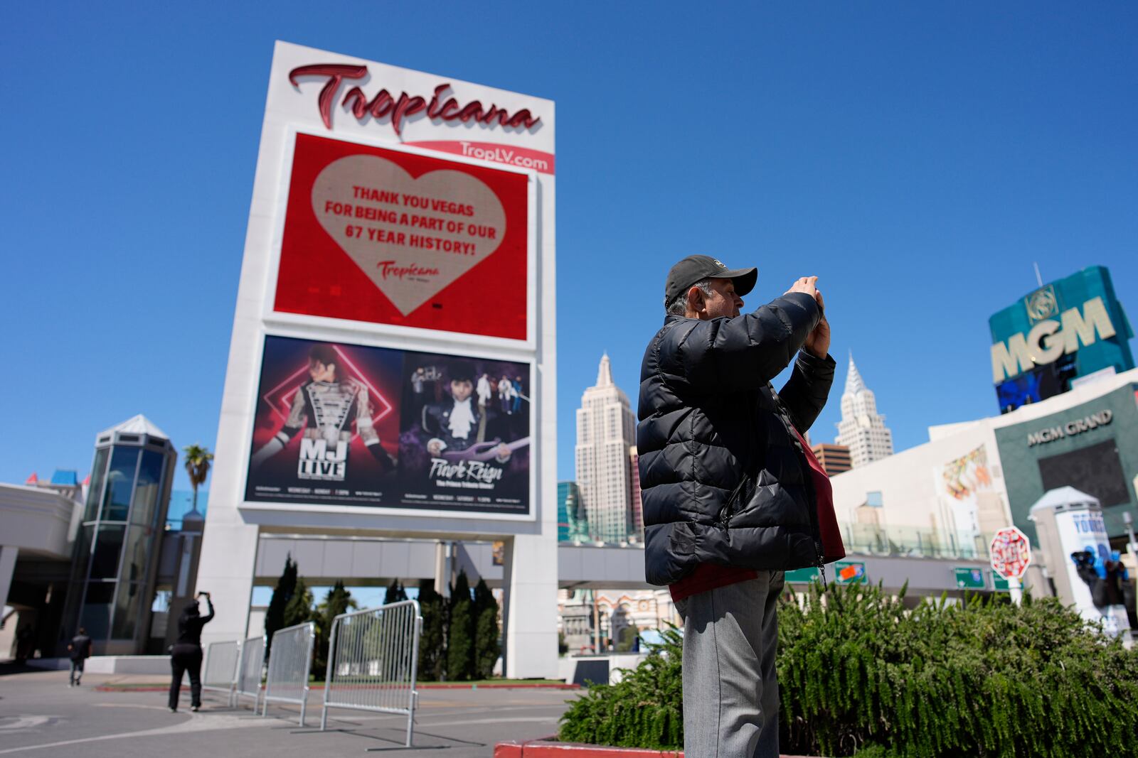 FILE - People take pictures before the closing of the Tropicana hotel-casino, Tuesday, April 2, 2024, in Las Vegas. (AP Photo/John Locher, File)