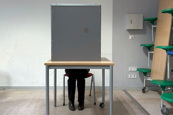 Gesa Schoenwolff casts her vote at a polling station in Berlin, Germany, Sunday, Sept. 23, 2025, during the German national election. (AP Photo/Philipp-Moritz Jenne)