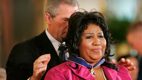 FILE - In this Nov. 9, 2005 file photo, President George W. Bush awards singer Aretha Franklin the Presidential Medal of Freedom Award, the highest civilian award, in the East Room of the White House in Washington. (AP Photo/Lawrence Jackson, File)