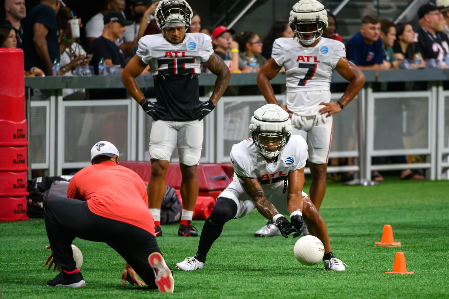 Falcons running backs drill with a coach. (Jamie Spaar for the Atlanta Journal Constitution)