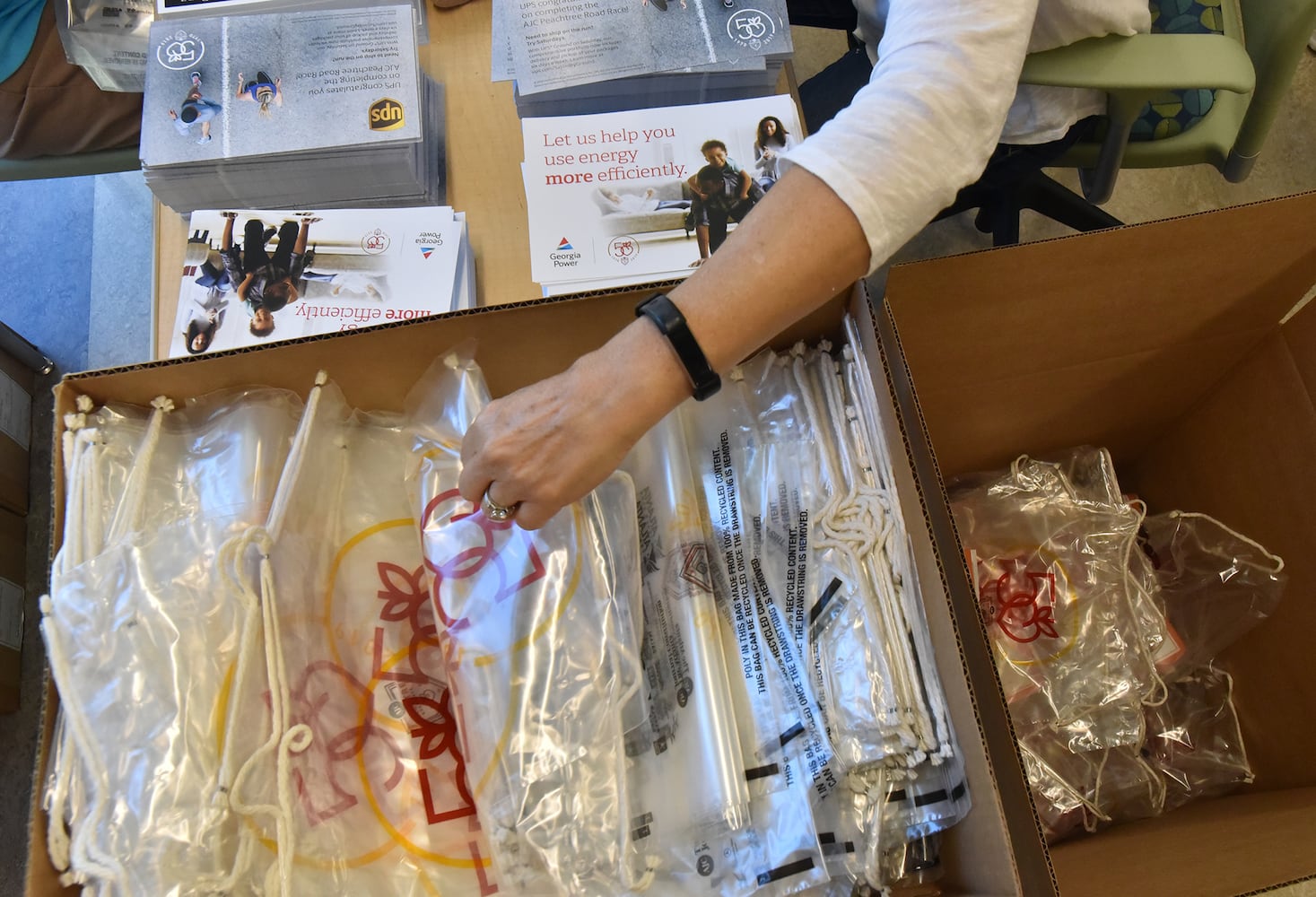 Volunteers prepare for the AJC Peachtree Road Race