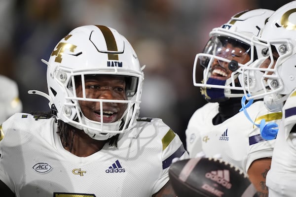 Georgia Tech linebacker E.J. Lightsey (2) celebrates a touchdown after an interception during the first half of an NCAA college football game against North Carolina State, Thursday, Nov. 21, 2024, in Atlanta. (AP Photo/Brynn Anderson)