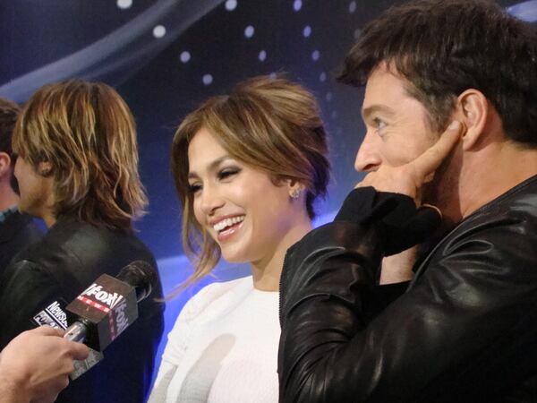 Jennifer Lopez is interviewed by the Atlanta media at the W Hotel during "Idol" auditions in late October. Harry Connick Jrs is on the right and that's the back of Keith Urban's head on the left. CREDIT: Rodney Ho/rho@ajc.com