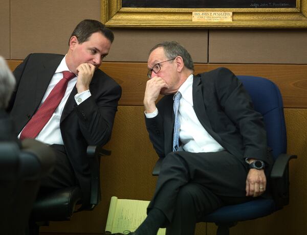 David Cohen (left) and John Butters listen to defense attorney Brian Steel argue to have the case dismissed on Day 4 of the trial at the Fulton County Courthouse on April 6, 2018. STEVE SCHAEFER / SPECIAL TO THE AJC