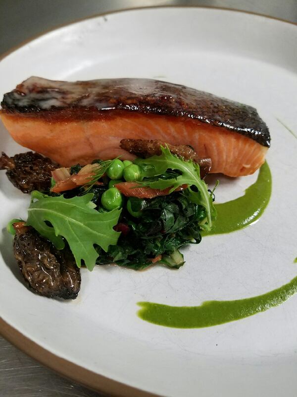 Signs of spring at Atlanta fine dining restaurant Bacchanalia include a dish of Ora King salmon that holds stinging nettles, wild watercress and morel mushrooms. (Photo by Joe Schafer)