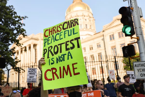 Demonstrators gather outside of the attorney general’s office in Downtown Atlanta on Friday, September 8, 2023. On Tuesday, Georgia Attorney General Chris Carr announced that a total of 61 training center activists have been charged with violating the state’s Racketeer Influenced and Corrupt Organizations act. (Natrice Miller/ Natrice.miller@ajc.com)