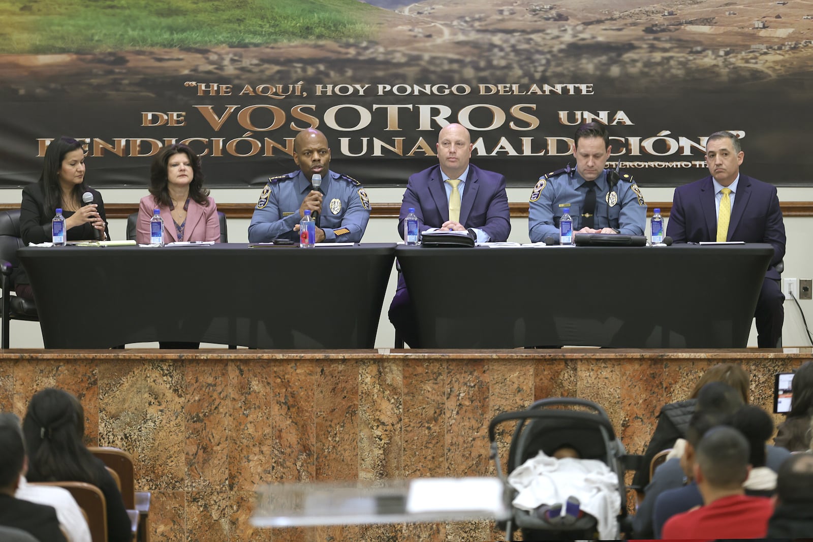 Gwinnett law enforcement officers talk to members of the community during a town hall to address youth violence at Universal Church in Norcross on Thursday, March 9, 2023. (Natrice Miller/ Natrice.miller@ajc.com)