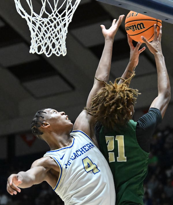 McEachern's Ace Bailey (4) and Grayson's Jacob Wilkins (21) fight for a rebound during the first half of Saturday's Class 7A boys championship game in Macon. (Hyosub Shin/hshin@ajc.com)