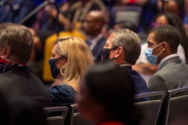 Gov. Brian Kemp and first lady Marty Kemp attended a Blacks for Trump campaign rally Friday at the Cobb Galleria Centre. They were wearing masks, but many at the indoor rally did not. (Alyssa Pointer / Alyssa.Pointer@ajc.com)