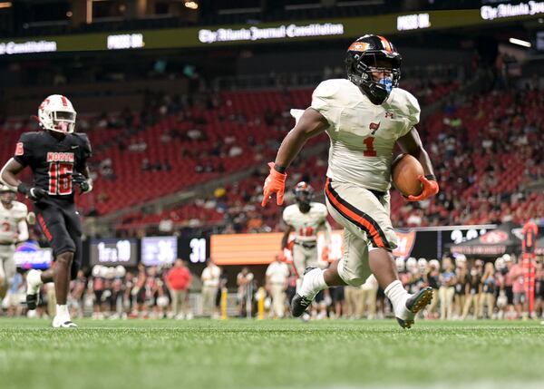 Hoover running back Ahamari Williams (1) carries the ball for a touchdown late in the second half of the Corky Kell Classic matchup Saturday, Aug. 21, 2021, at the Mercedes Benz Stadium in Atlanta. (Daniel Varnado/For the AJC)