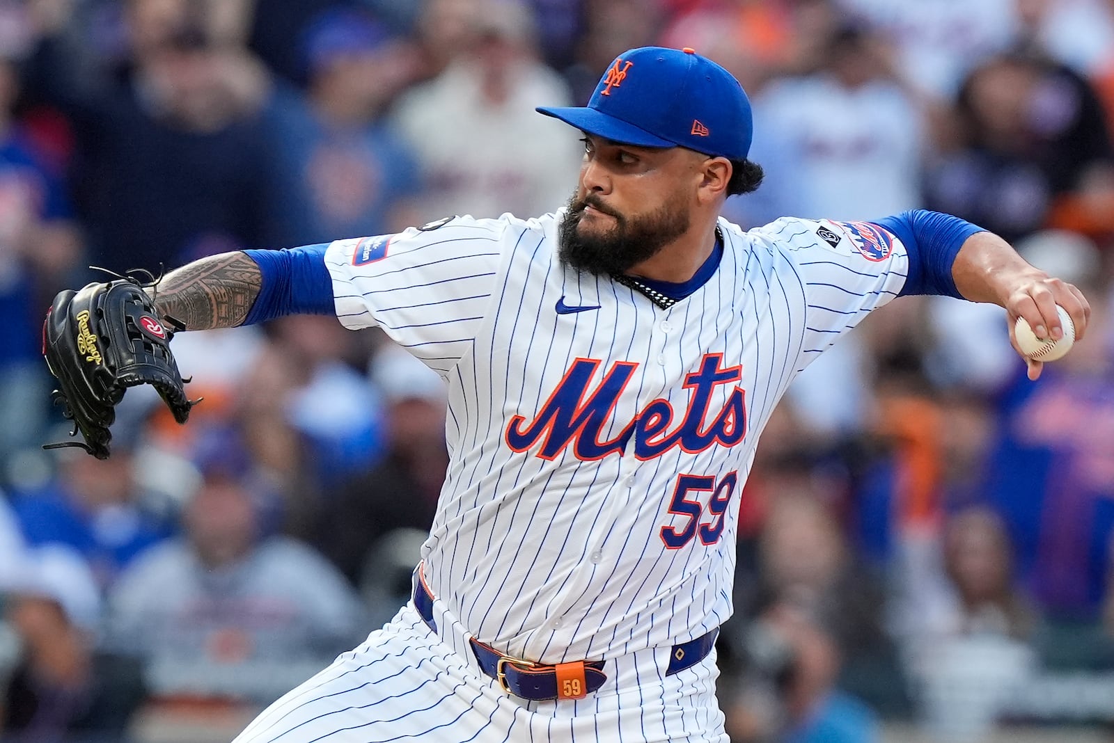 New York Mets pitcher Sean Manaea (59) delivers against the Philadelphia Phillies during the first inning of Game 3 of the National League baseball playoff series, Tuesday, Oct. 8, 2024, in New York. (AP Photo/Frank Franklin II)