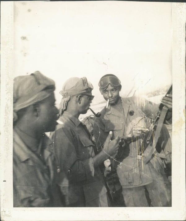 Jon Wambi Cook, center, who served as a radio operator with the 173rd Airborne Brigade during the battle for Hill 875, said the U.S. Marine jet’s bomb hit close enough to him that “it bounced me up off the ground.”