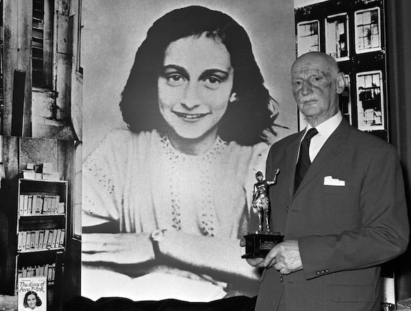 FILE - In this Monday, June 14, 1971 photo Dr. Otto Frank holds the Golden Pan award, given for the sale of one million copies of the famous paperback 'The Diary of Anne Frank' in London, Great Britain. New research suggests that the family of Anne Frank, the world-famous Jewish diarist who died in the Holocaust, attempted to immigrate to the United States and later also to Cuba, but their efforts were tragically thwarted by Americaâs restrictive immigration policy, cumbersome bureaucracy and the outbreak of World War II. Only Otto Frank survived the holocaust. (AP Photo/Dave Caulkin, file)