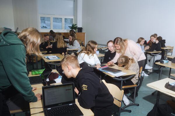 Saara Martikka, right, teaches students about misinformation at a school in Hameenlinna, Finland, Dec. 8, 2022. The Nordic country is testing new ways to teach students about propaganda. (Vesa Laitinen/The New York Times)