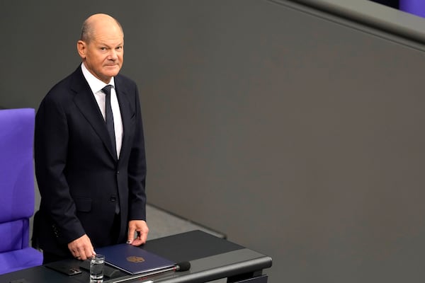 German Chancellor Olaf Scholz attends a plenary session in the German parliament Bundestag in Berlin, Germany, Wednesday, Nov. 13, 2024. (AP Photo/Markus Schreiber)