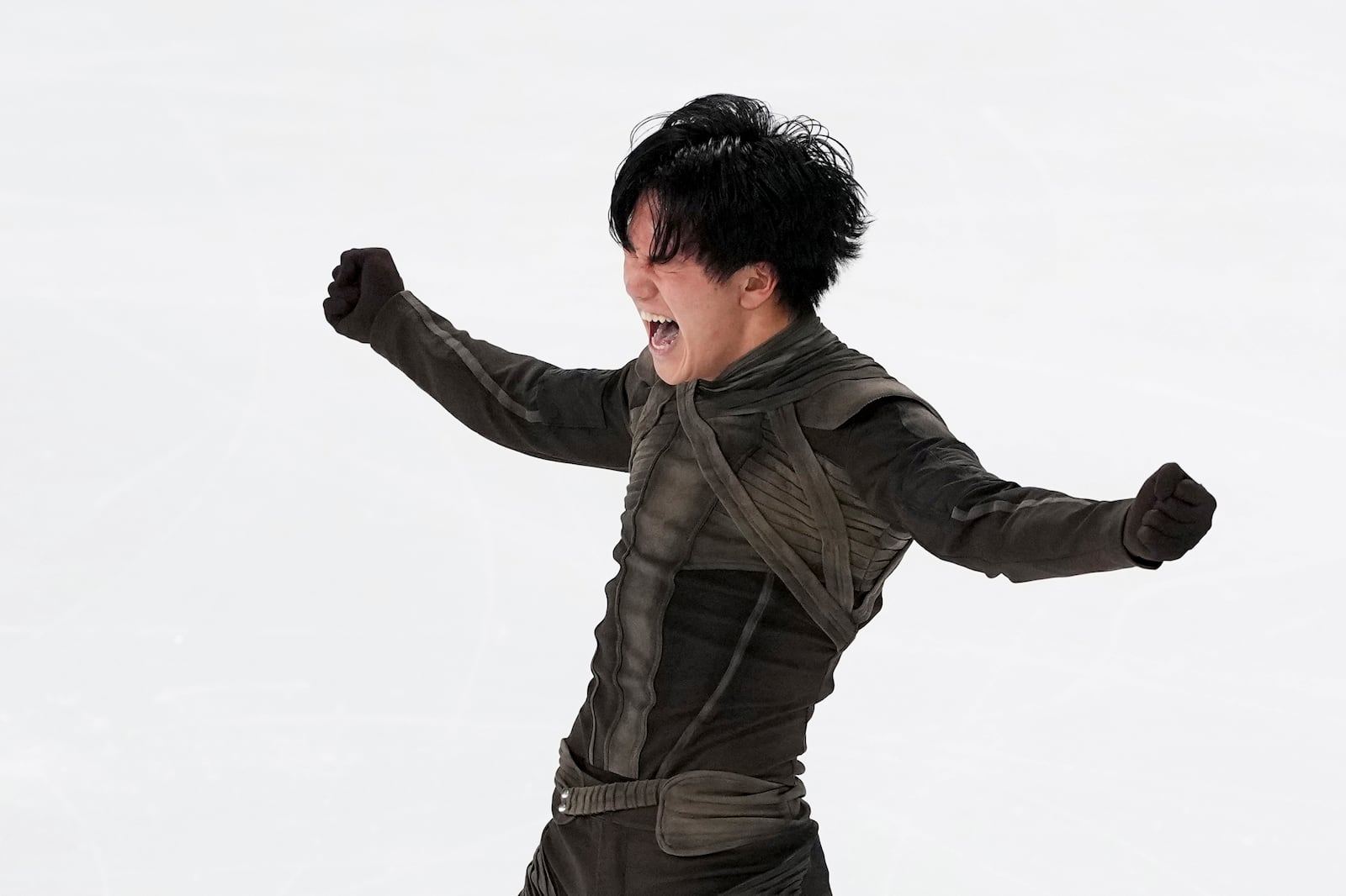 Adam Siao Him Fa, of France, reacts after competing in the men's free skating segment at the ISU Grand Prix of Figure Skating, Saturday, Nov. 2, 2024, in Angers, France. (AP Photo/Aurelien Morissard)