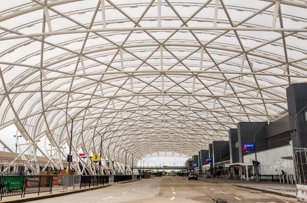 Atlanta’s Hartsfield-Jackson International Airport is basically empty midday Wednesday, April 8, 2020. Curbside check-in is closed, parking lots have very few cars, and flights are minimal. (Jenni Girtman for The Atlanta Journal-Constitution)