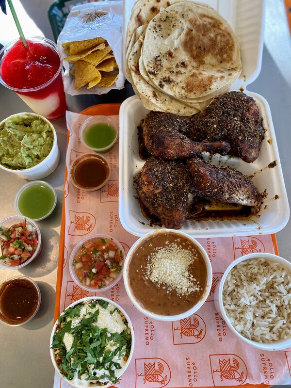 Pollo Supremo’s whole chicken meal is seen here, with guacamole, chips and a margarita. Wendell Brock for The Atlanta Journal-Constitution