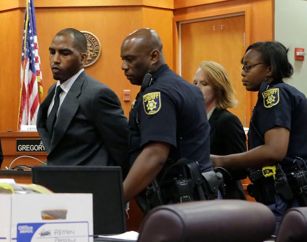 Aeman Presley is taken into custody on June 13, 2015 following his guilty plea in DeKalb County Court to the deaths of two homeless men in 2014, and the murder of a woman he robbed. (Bob Andres / bandres@ajc.com)