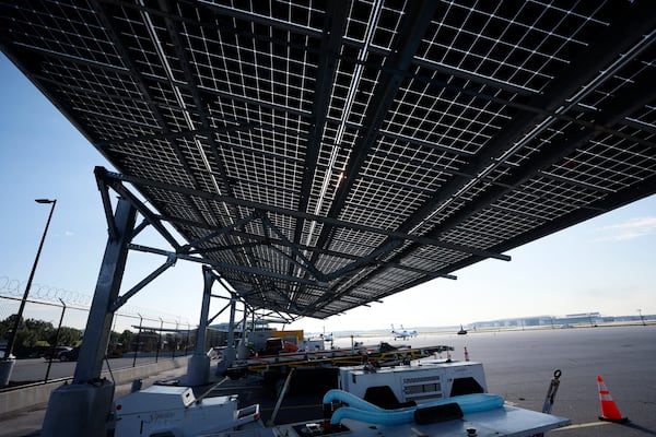 Installed by Cherry Street Energy in 2021, solar panels are seen at Signature Flight Support at Hartsfield-Jackson Atlanta International Airport on Thursday, Sep. 7, 2023. The city of Atlanta plans to contract Cherry Street Energy to install more solar panels to help power airport buildings.
Miguel Martinez /miguel.martinezjimenez@ajc.com