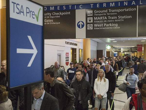 Multiple security lines at Hartsfield-Jackson International Airport ran across the atrium then snaked through baggage claim in both domestic terminals on Monday February 4th, 2019. Official expected over 100,00 travelers to pass through the airport today. (Photo by Phil Skinner)